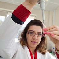 A researcher with a pipette