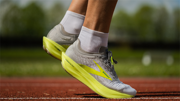 Close up shot of running trainers on a track