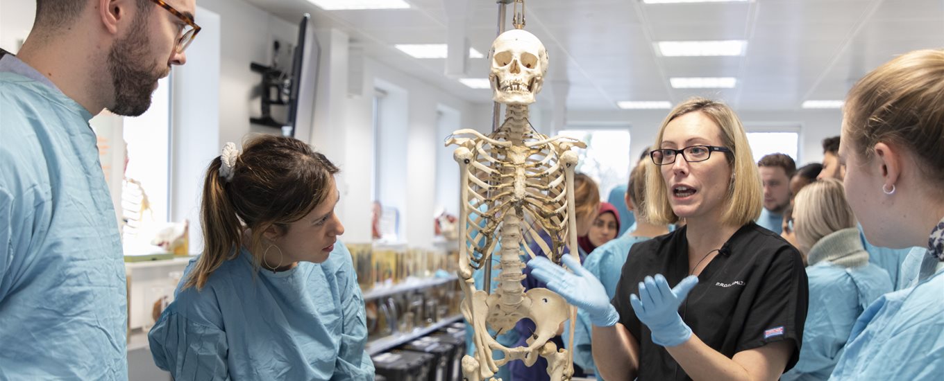 Prof Claire Smith talking to students in anatomy lab