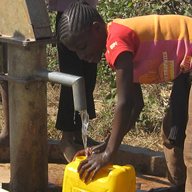A child collects water from a well