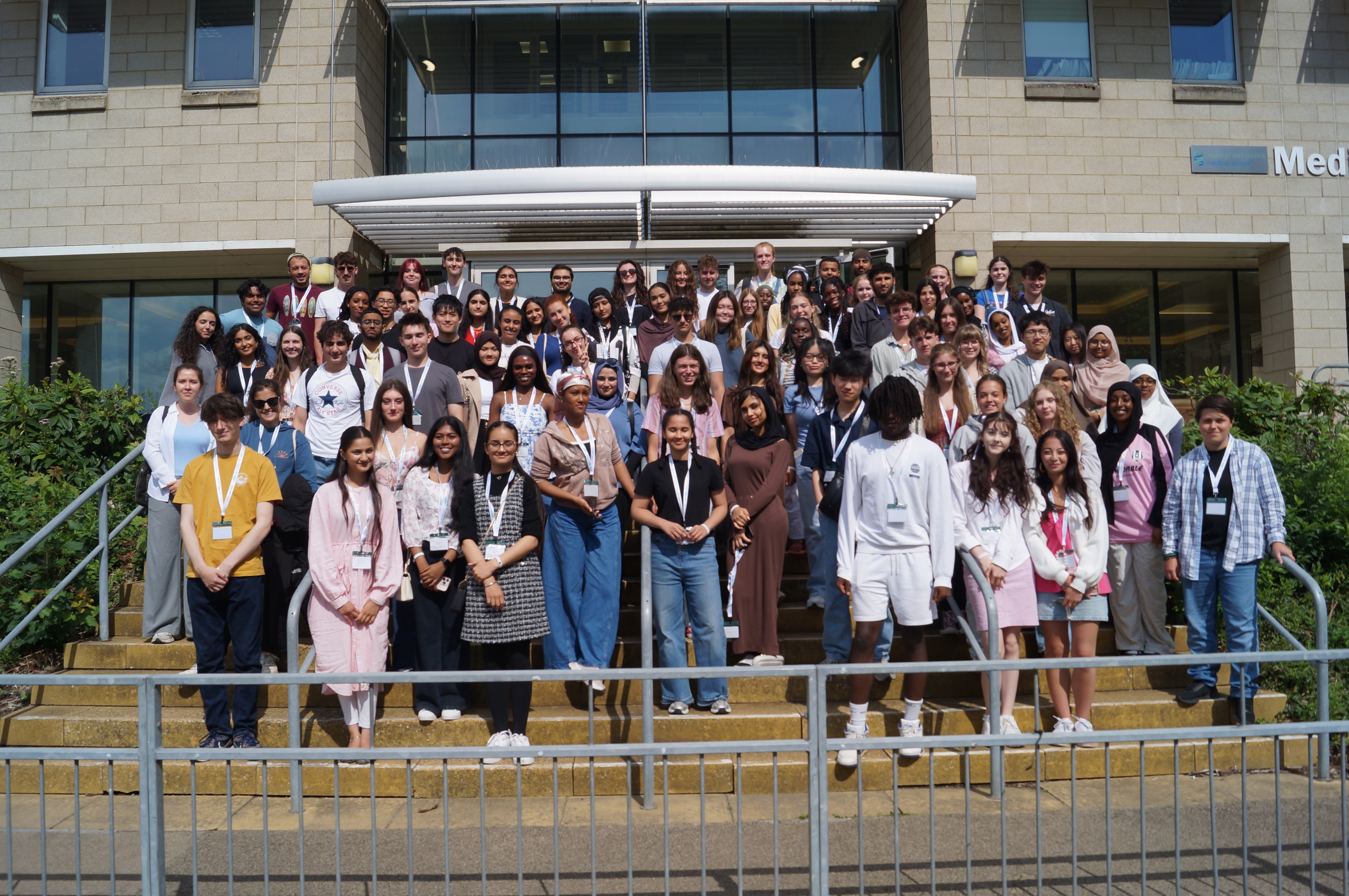 A group photo of students stood outside the medical school as part of the BrightIdeas programme 2025