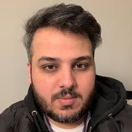 A head and shoulders photo of Fisal Tantoush