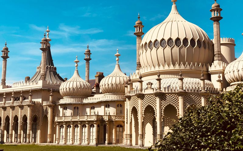 A photo of the Brighton Pavilion in the sun with a blue sky in the background