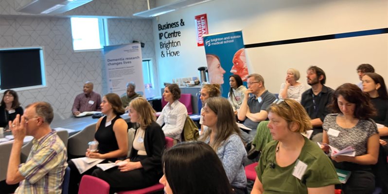 A group of people listening to talks organised by BSMS for the Lifestyle and Cognitive Health Symposium in July 2023 at the Jubilee Library in Brighton