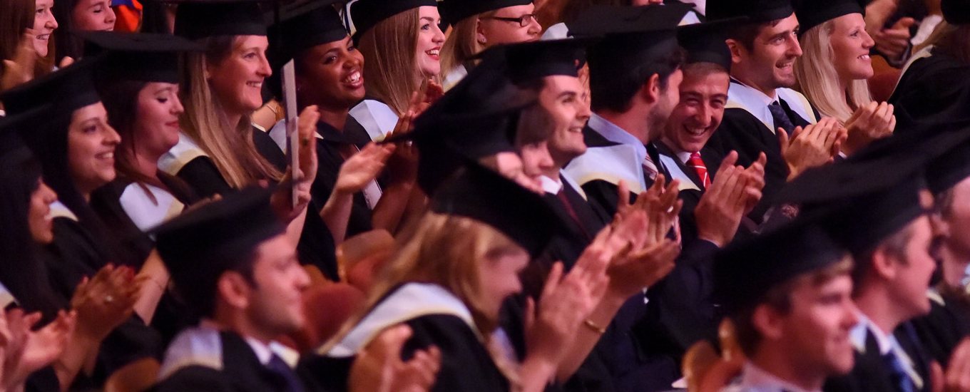 Smiling students at graduation