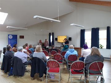 A group of people seated for a workshop