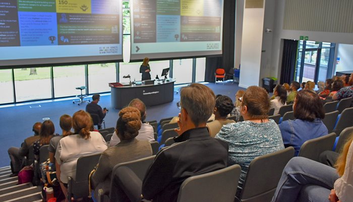 A group of people in the audience at the Sussex Clinical Academic Conference 2024