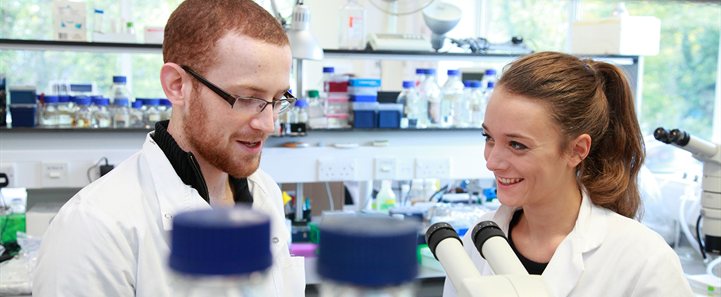 Students in lab smiling