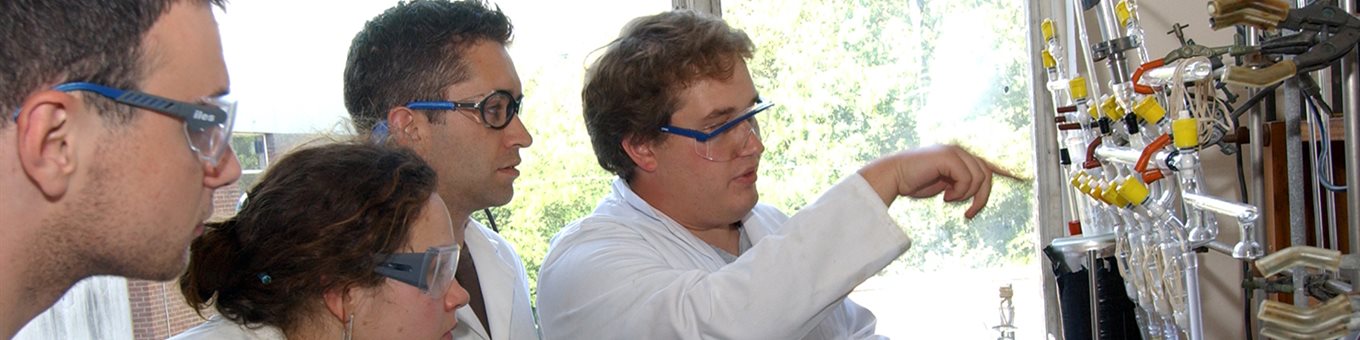 man demonstrating in lab to students