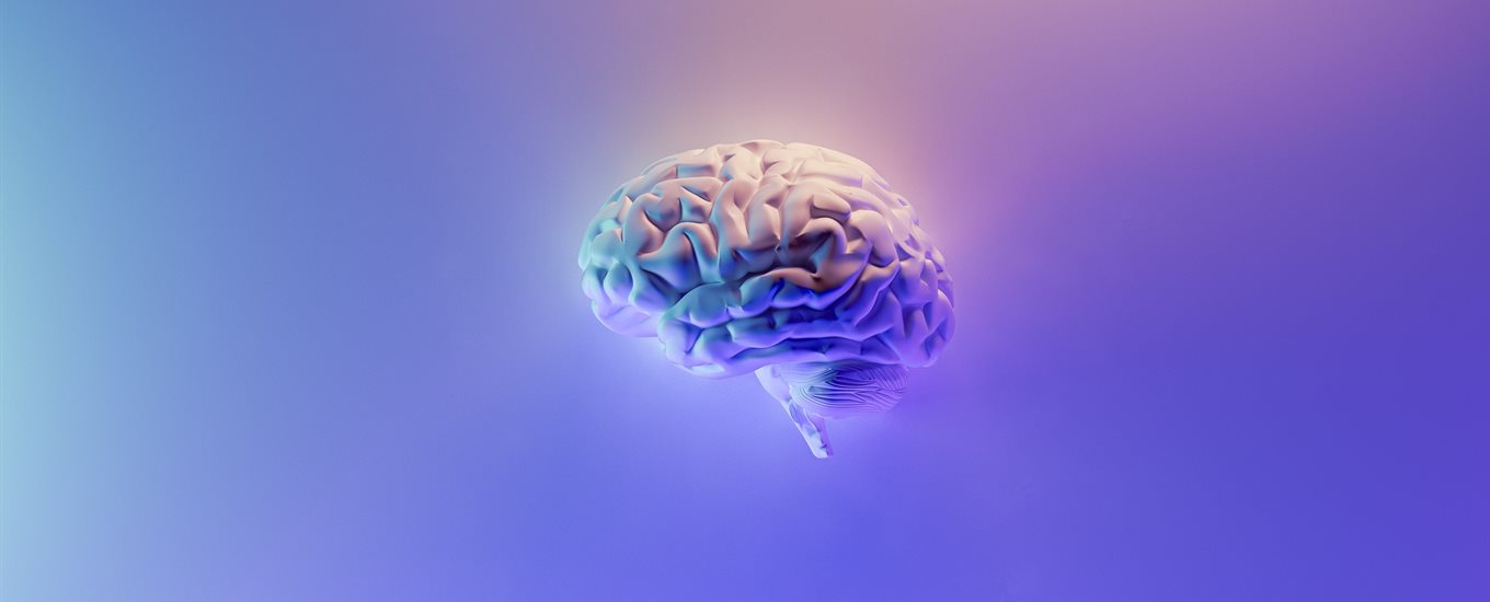 A purple brain in the distance on a blue/purple background