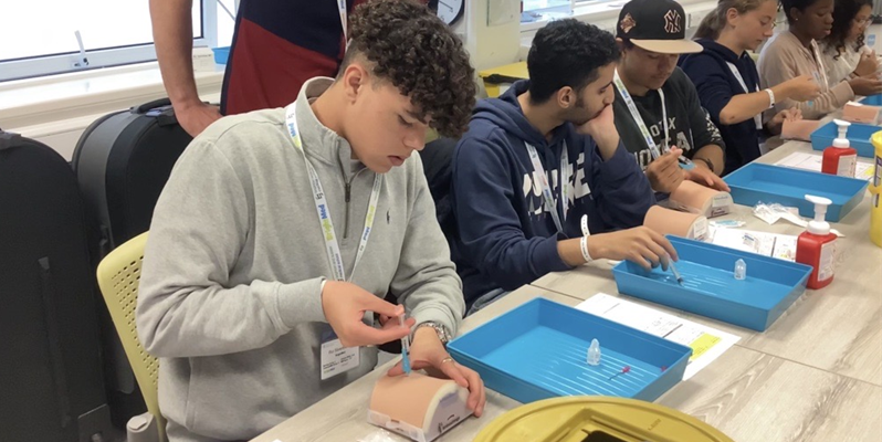 A group of year 12 students learn clinical skills at the BSMS summer school 2023