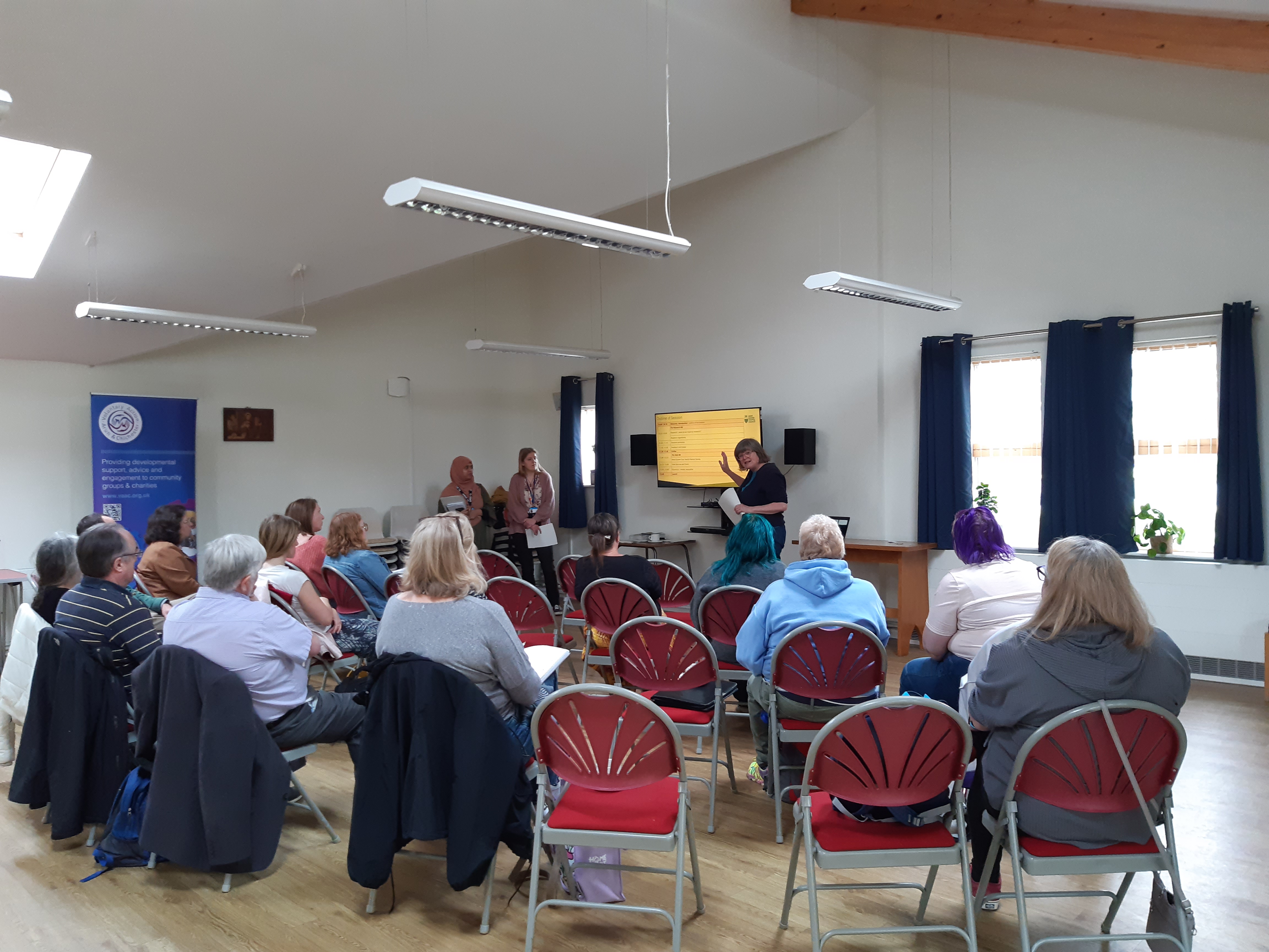 A group of people seated for a workshop