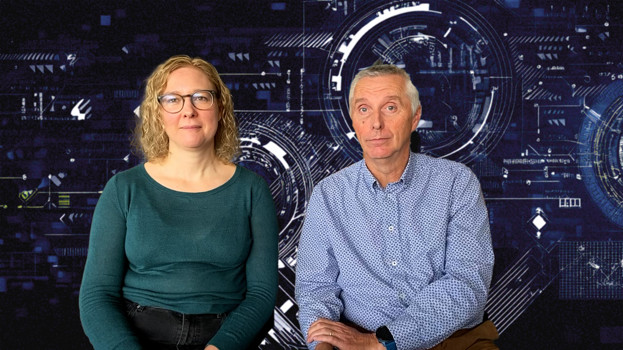 Photograph of two people Liz and John sitting next to each other