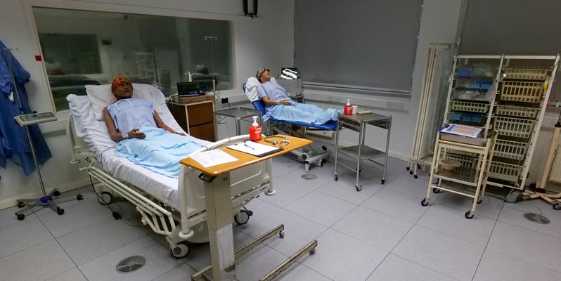 Two mannequins on patient beds in the simulation suite at BSMS