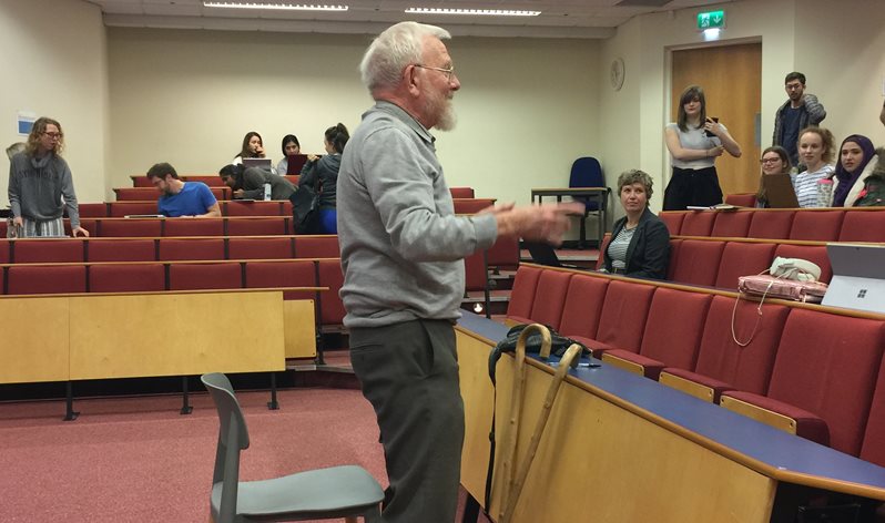 Will Cassell in the lecture theatre with students in 2018