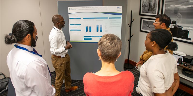 LEF students at BSMS presenting posters to a group