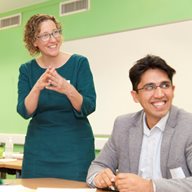 Smiling teacher and student