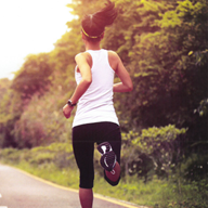 Woman running on country road