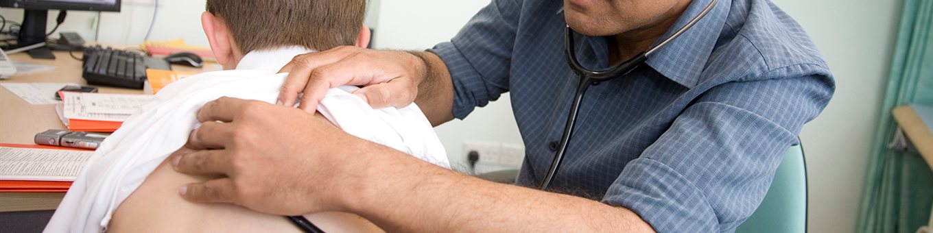 Consultant listening to patients heart beat