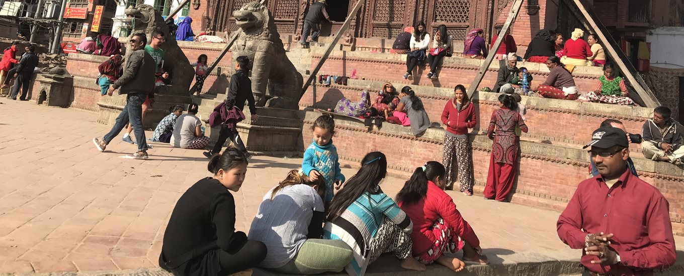 A group of people outside a building in Nepal