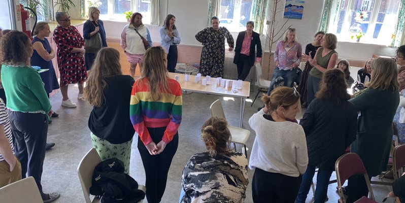 A group of people networking at an event