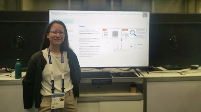 Anne Josset standing in front of a presentation screen