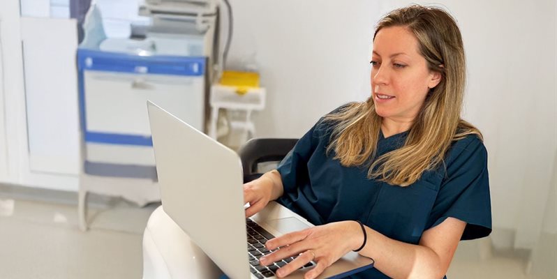 Lucia Macken from the Brighton and Sussex Liver Research Centre on a laptop