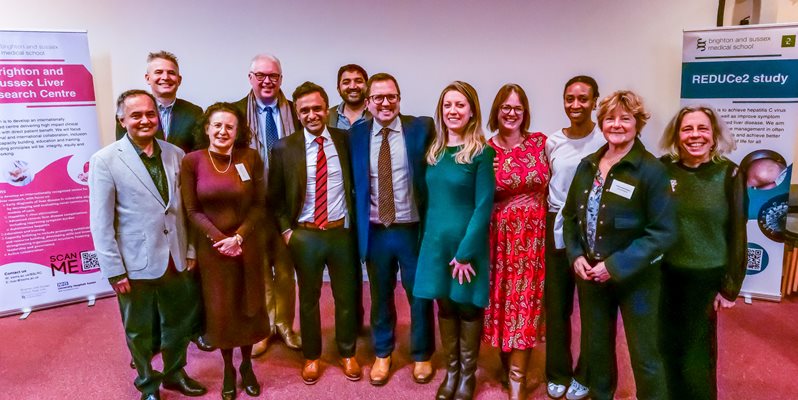 A team of people in a group pose at the BSLRC launch