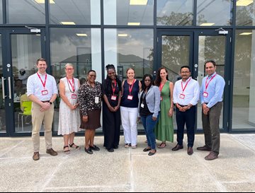 A group of researchers from the Malawi&ndash;Liverpool&ndash;Wellcome Programme group outside a building
