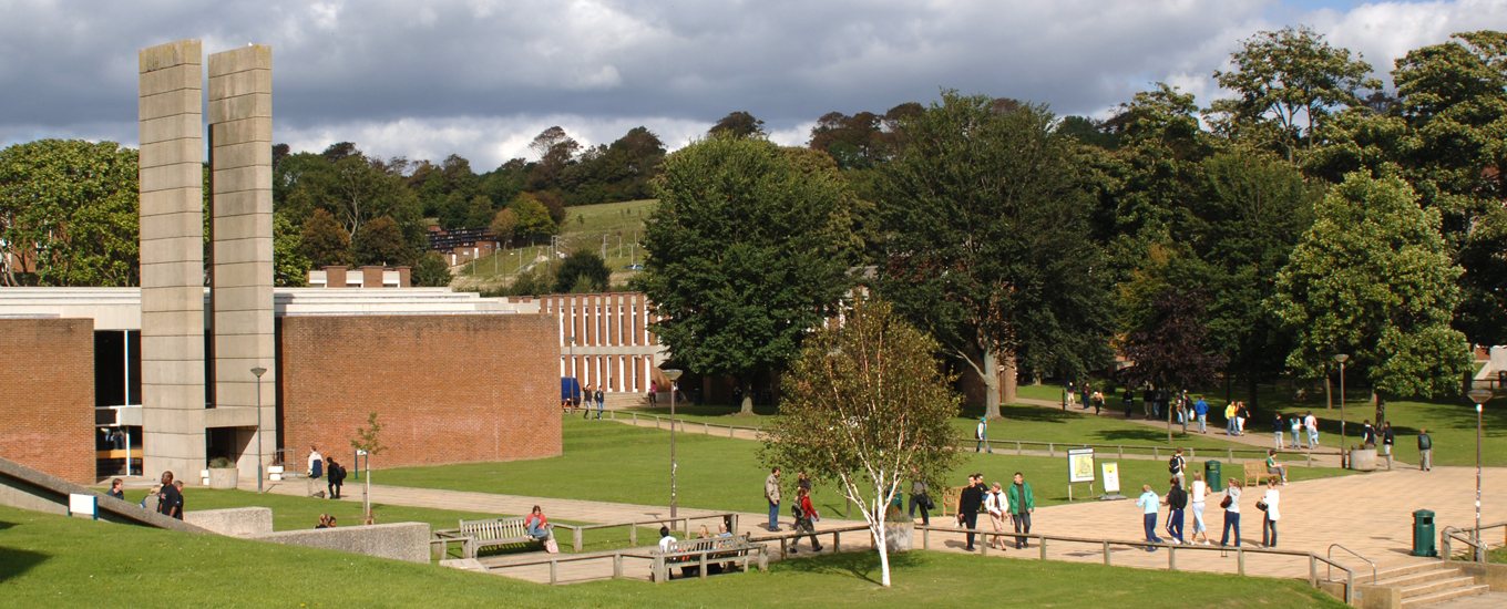 University of Sussex grounds showing the large concrete 'H' entrance of the arts block