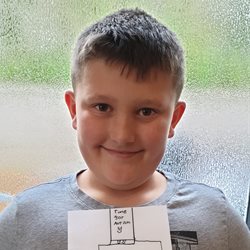 Charlie Green holding his competition entry
