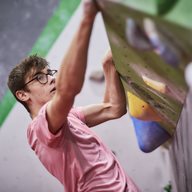 A student on a bouldering wall