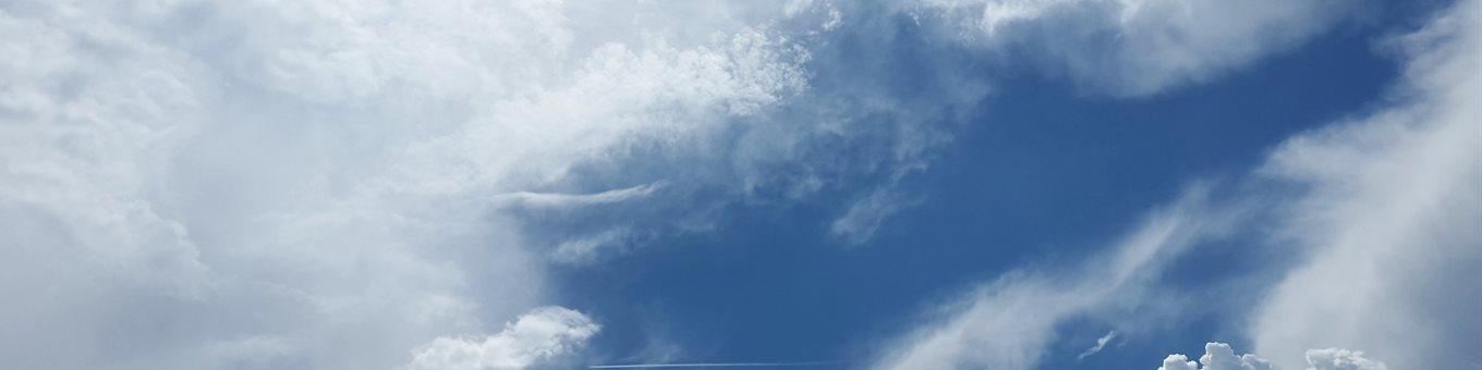 Large fluffy clouds on blue sky