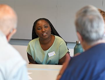 A student and families with dementia talking at an event