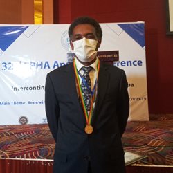 Abebaw receiving his public health award medal