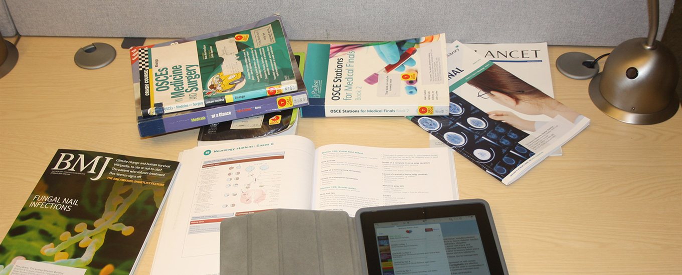 Books and tablet on a desk