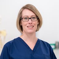 Claire Smith pictured in the anatomy suite in blue scrubs