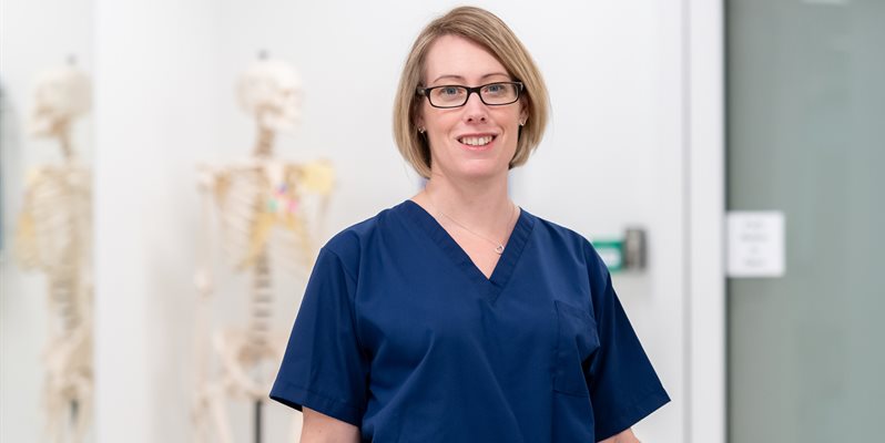 Prof claire smith wearing blue scrubs in the anatomy suite at bsms