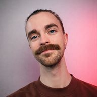 A photo of Eugene Pashnin against a colourful tinted background