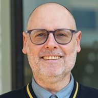 A head and shoulders image of Gavin Peacock