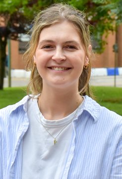 A head and shoulders photo of Rachel Jackson from BSMS, taken outside in front of grass and a building