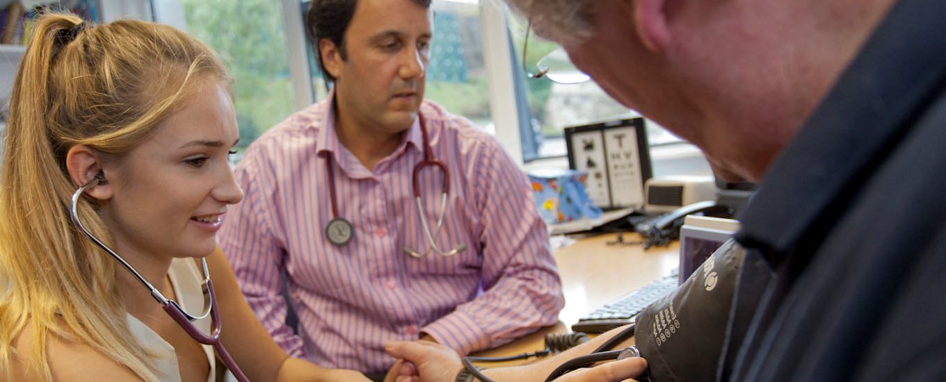 Student takes patient's blood pressure