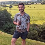 BSMS student Ollie Pentz pictured in a green field with trees wearing a shirt and shorts