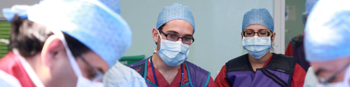 two student observe surgery